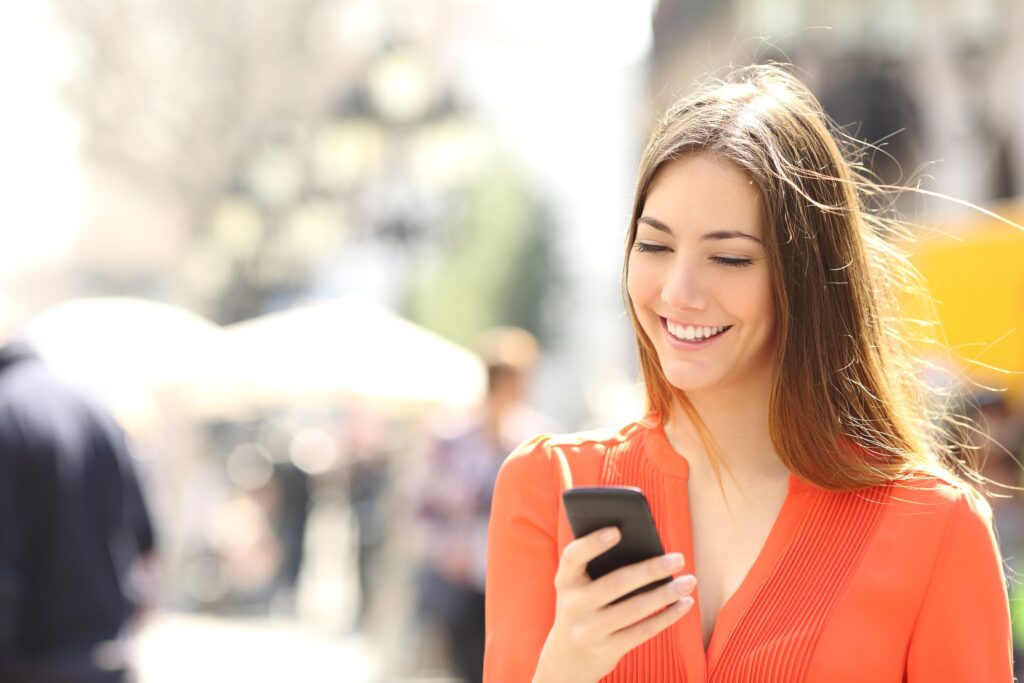 woman on the street using voice search