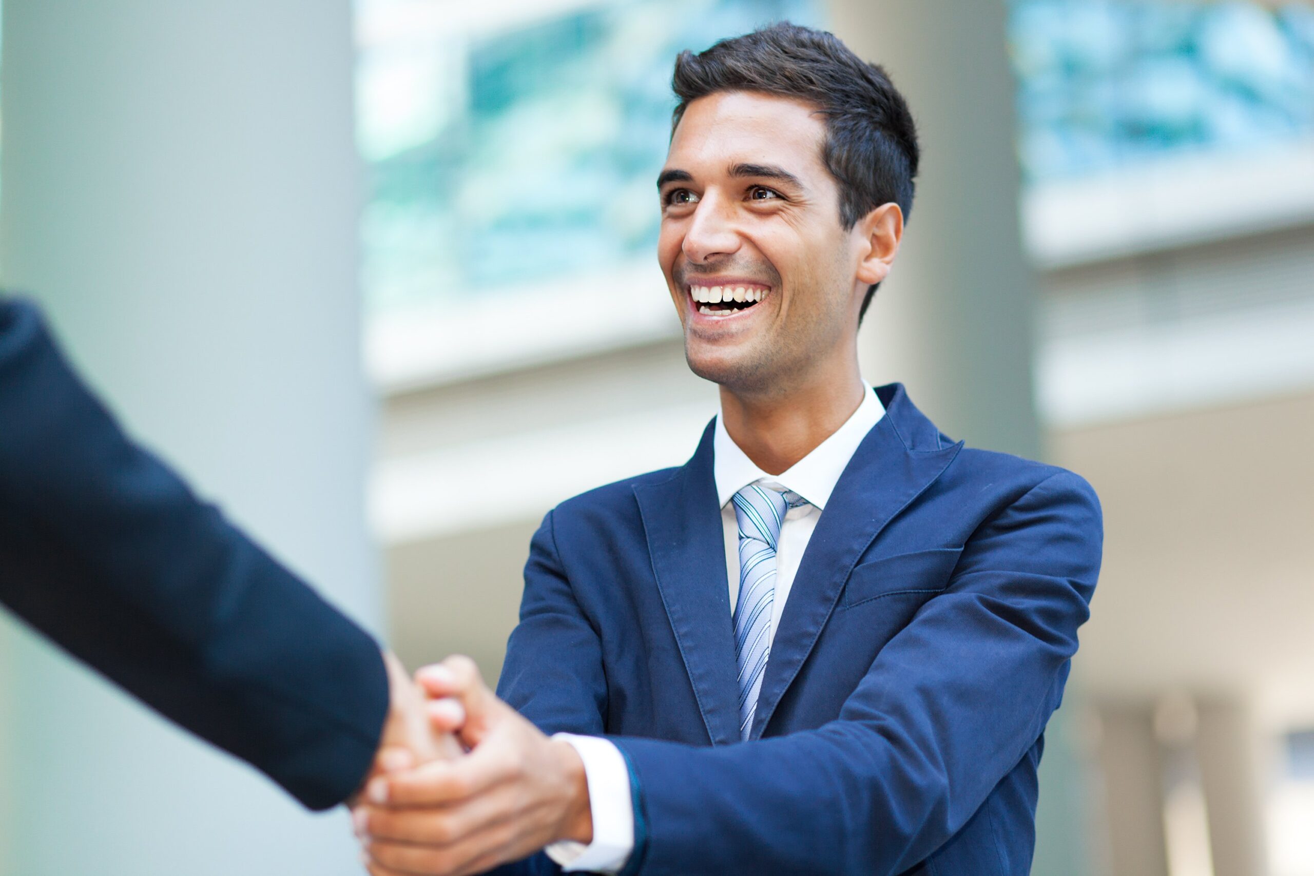 two local business owners shaking hands