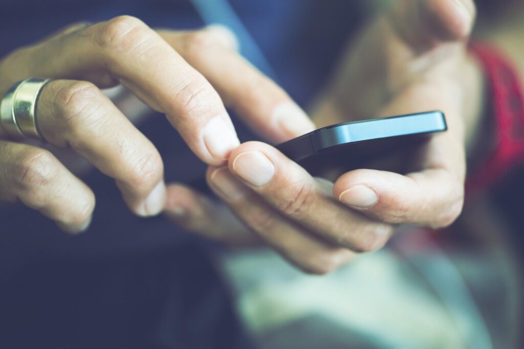 middle-aged man using a smart mobile phone