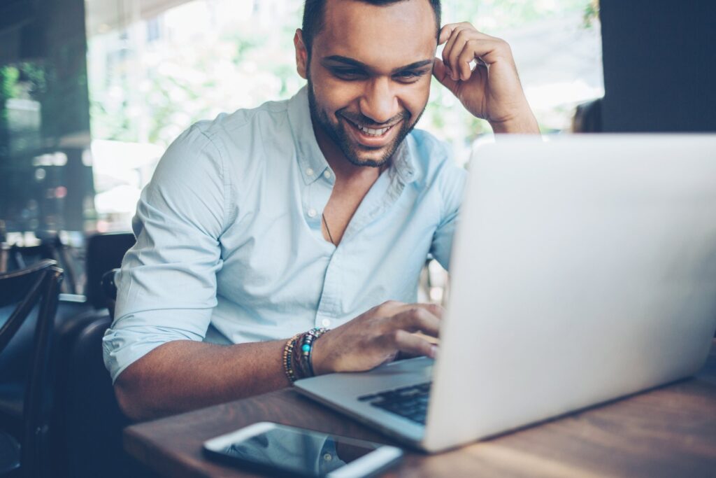 Man using laptop to work on local seo campaign